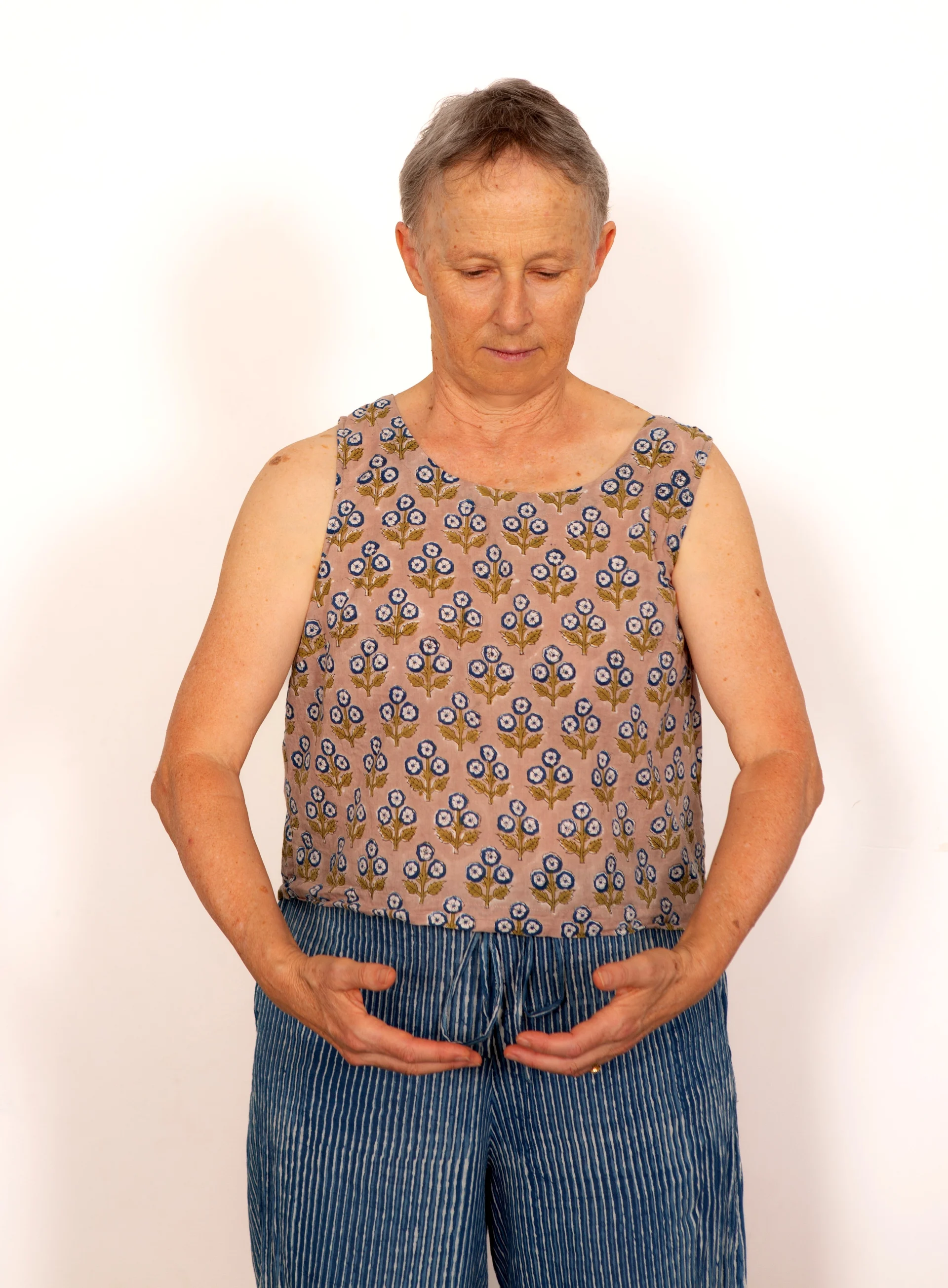 Helen Rowlands, Qi Gong teacher and Rapid Coherence somatic coach on the Gold Coast, standing in a calm, grounded pose with hands resting gently